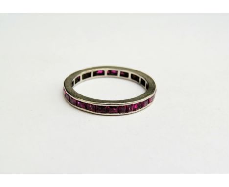 A ruby eternity ring, unmarked platinum shank. Size O, 2.5g 