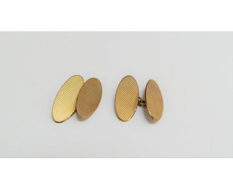 A pair of 9ct gold engine turned oval cufflinks, 3.4g 