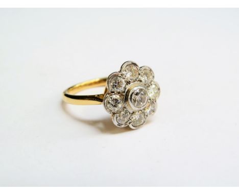 A gold diamond daisy ring, 1.5ct total approx, unmarked. Size K, 4.3g 