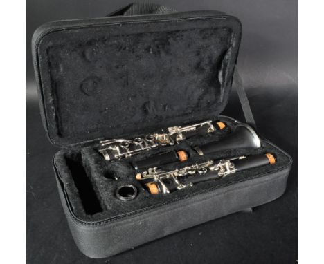 An original Stagg made clarinet musical instrument model WS CL210. The clarinet appears in good condition within fitted case.