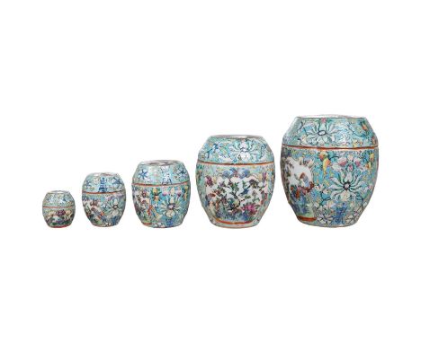 A Chinese porcelain nest of five enamelled porcelain barrel shaped boxes, c.1900, largest 12cm high. Condition - fair, some m