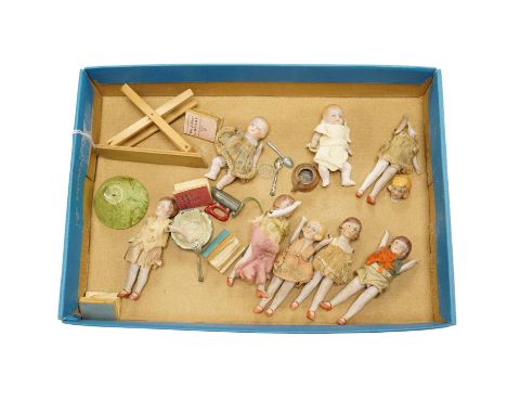 Eight early 20th century ceramic ‘doll's house’ dolls, approx 8cm long, with articulated limbs, together with a small quantit