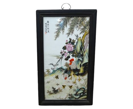 A Chinese famille rose porcelain plaque depicting cockerels and chicks before a landscape, signed with character marks and re