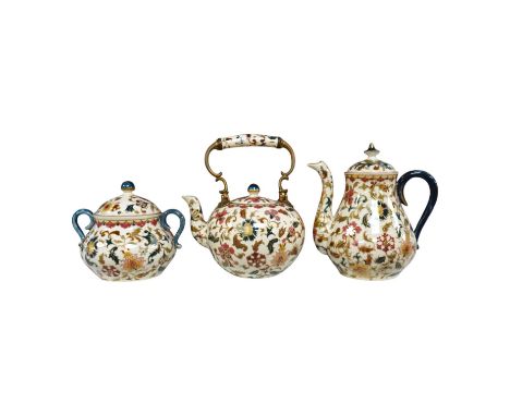 A matched Hungarian Zsolnay floral three piece tea set, largest 17cm high. Condition - fair, crazing throughout