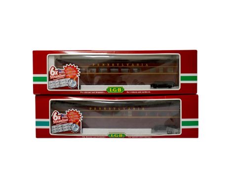 Three boxed G scale American outline bogie coaches; two Pennsylvania (32580 and 32590), and a Santa Fe (20582). Condition - g