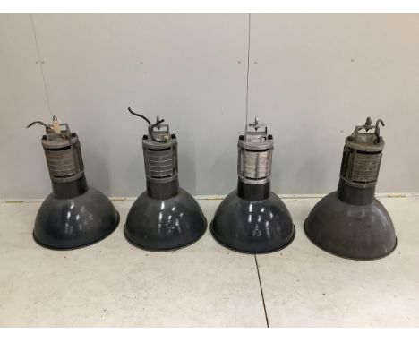 A set of four mid century Mazda industrial ceiling lights, height 68cm, diameter 50cm and one other light. Condition - fair t