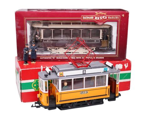 Two boxed G scale pantograph electric tramcars; a Bachmann Big Haulers tram in Hershey’s livery and a Lehmann LGB tram. Condi