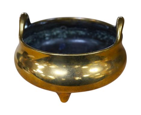 An 18th / 19th century Chinese bronze tripod censer with twin handles, 9cm diameter, 0.320g. Condition - good