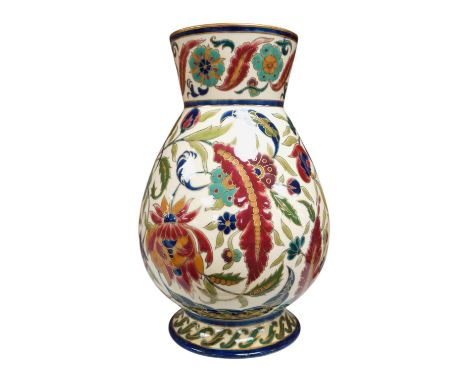 A large Hungarian Zsolnay floral vase, 32cm high. Condition - fair -&nbsp;The vase has been restored.