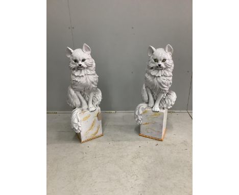 A pair of Italian white glazed ceramic models of seated cats, height 83cm. Condition - fair to good