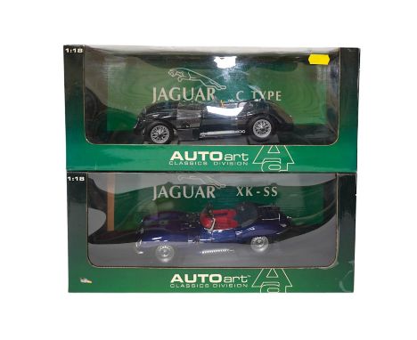 Two boxed AutoArt Classics Division 1:18 scale diecast cars; a Jaguar XKSS and a Jaguar C Type. Condition - good.