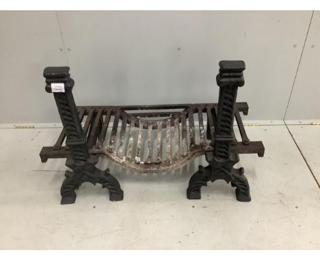 A pair of black painted cast iron fire dogs, a fire basket and a wrought iron fender. Condition - fair