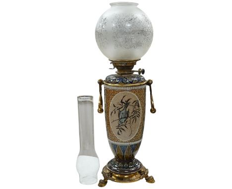 Florence Barlow for Doulton Lambeth, a stoneware oil lamp, pate sur pate decoration, 1883, with associated reservoir, 47cm to