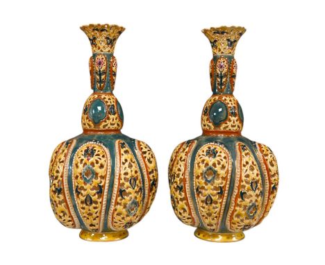 A pair of Hungarian double walled Zsolnay reticulated vases, 29cm high. Condition - some restoration