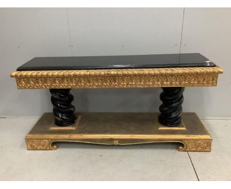 A Harrison Gil parcel gilt console table with marble inset top, width 180cm, depth 51cm, height 85cm and matching ornate wall