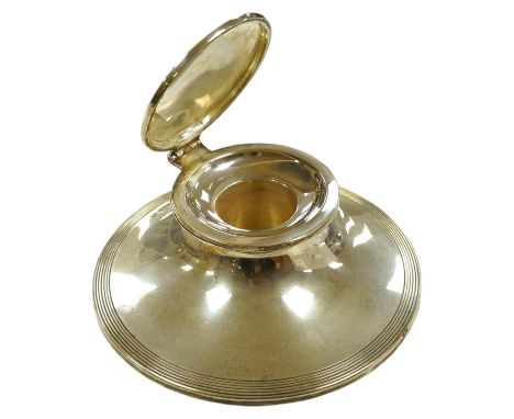 A George V reeded silver capstan inkwell with loaded base, 15cm diameter. Condition - good