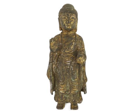 A Chinese gilt bronze model of a standing Buddha, 21.5cm. Condition - poor to fair