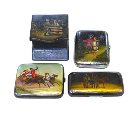 Three Russian lacquer cigarette cases, one decorated with a troika scene and a match strike, 11cm wide. Condition - good