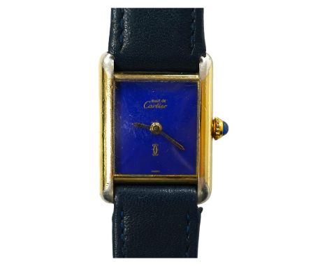 A lady's gilt 925 Must De Cartier manual wind wrist watch, with lapis lazuli rectangular dial and cabochon sapphire set windi