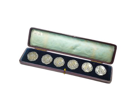 A cased set of six Edwardian Art Nouveau silver buttons, decorated with the head of a lady, import marks for Robert Friederic