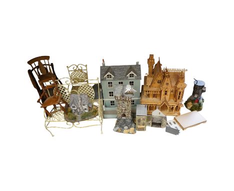A modern plywood slot together model of a chateau, 50cm high, together with six miniature doll’s houses, a miniature wrought 