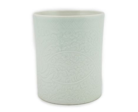 A Chinese celadon glazed brush pot, Kangxi style, 15.5cm high. Condition - good