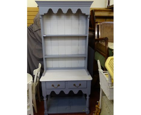 Painted compact dresser of two shelves with two base drawer over a lower shelf