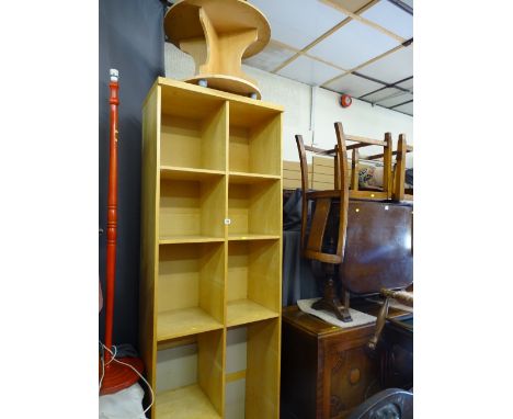 Modern multi-shelf bookcase and small circular occasional table