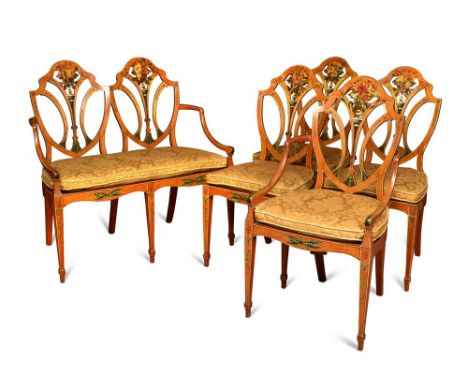 A suite of Sheraton revival painted satinwood chairs and settee by Wright & Mansfield, banded in tulip wood, and painted with