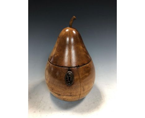 A 19th century fruitwood tea caddy in the form of a pear, the hinged lid with carved stalk opening to reveal a once zinc line