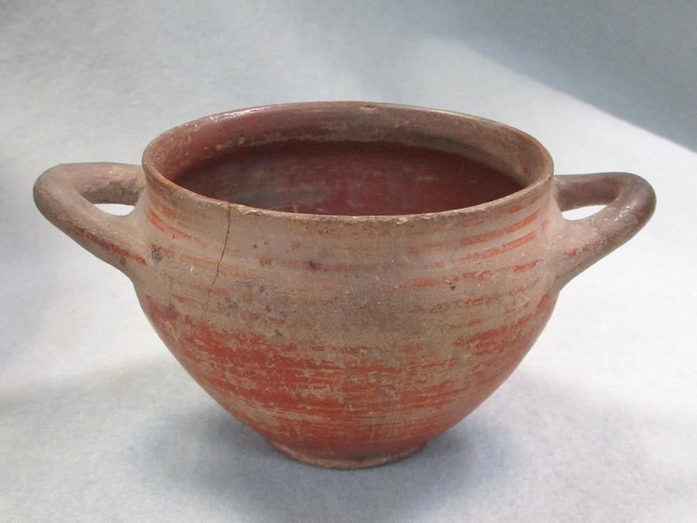 Three medieval earthenware vessels, to include a pedestal bowl, 10cm