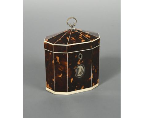 A George III tent-top tortoiseshell tea caddy, of decagonal form with ivory stringing and white metal blank oval cartouche an