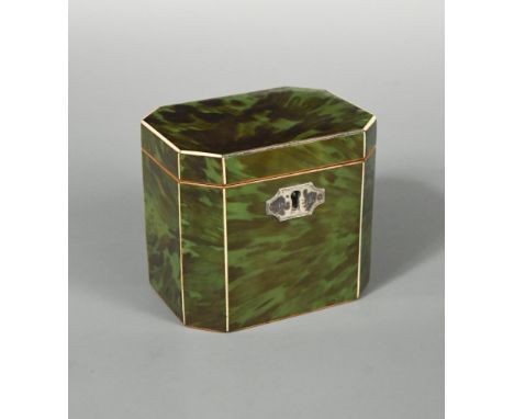 A Regency green stained tortoiseshell tea caddy, of rectangular form with canted corners and ivory stringing and white metal 