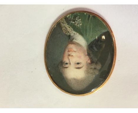 French School, 18th Century  Portrait miniature of a gentleman, in a powdered wig, wearing a green jacket with lace watercolo