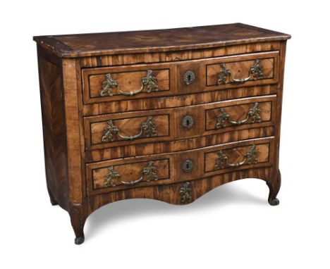An 18th century Maltese olive wood commode, of serpentine outline, quarter veneered in panels to an ebony line inlaid and cro
