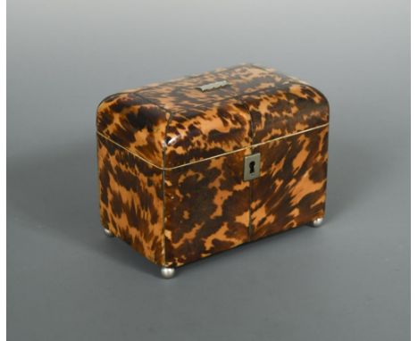 A Regency tortoiseshell tea caddy, the rounded top with silvered stringing opening to reveal twin compartments with ivory ban