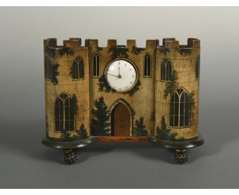 A Regency painted bamboo and wood watch holder and watch, the castellated architectural facade with central watch holder hold