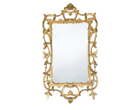 A Chippendale period carved giltwood framed mirror, pierced C scroll and trailing leaf carved decoration, 108 x 60cm (42 x 23