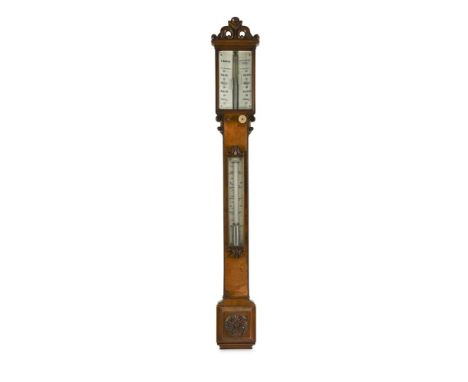A 19th century walnut stick barometer by C. Baker, London, with carved crest above twin ivorine registers, adjusters below fo