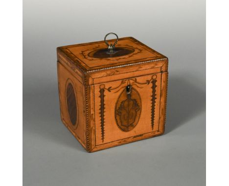 A Regency satinwood tea caddy, the rectangular form with inlaid ovals and marquetry decoration, the edges with crossbanding 1