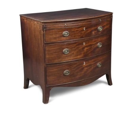A George III mahogany bow front chest of drawers, with a brushing slide and a fitted top drawer with baize lined slide, lidde