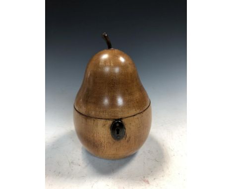 A 19th century fruitwood tea caddy in the form of a pear, the hinged lid with carved stalk opening to reveal a once zinc line