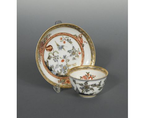 Two Meissen 'hausmalerei' tea bowls and a saucer, circa 1740 , decorated at the Ferner workshop, the centres with views of ci