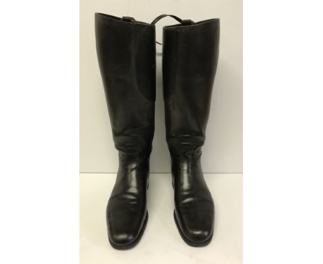 A pair of vintage black leather hunting boots, a box of various boot trees/parts, a pair of brown Brogini paddock boots with 