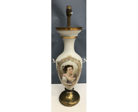 A circa 1900 frosted milk glass vase shaped table lamp decorated with portrait bust of a Spanish beauty in pearl necklace rai