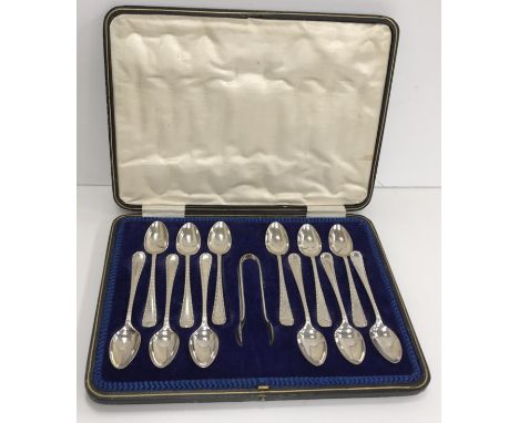 A George V silver set of twelve teaspoons and sugar tongs (by Charles Boyton & Sons Sheffield 1920), 6.5 oz