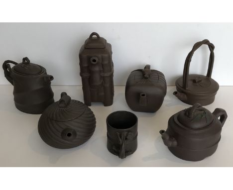 A collection of six Chinese Yi Xing tea pots various with various seal marks together with a Yi Xing coffee can with salamand