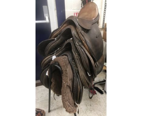 A collection of four leather general purpose saddles including a Hayes of Cirencester x 2, BP Swain of Walsall, another indis