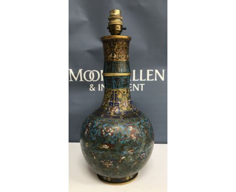 A Chinese cloisonné vase in the Qianlong manner, the ribbed waisted neck with archaic style script decoration on a turquoise 