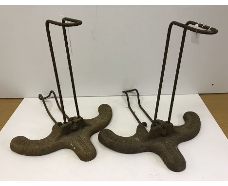 A pair of vintage cast and wrought iron bicycle stands by Albert Farnell of Bradford 41 cm wide x 41.5 cm high, tyre width ap